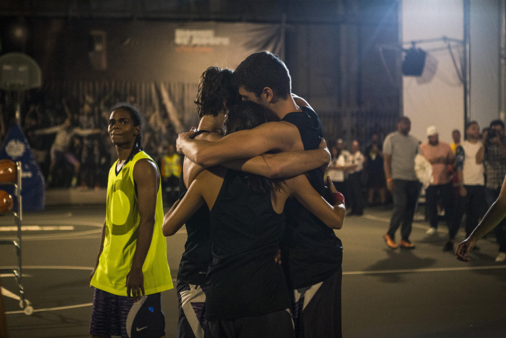 Victory. Young basketball players celebrate a win in the court's inaugural 3-on-3 tournament.