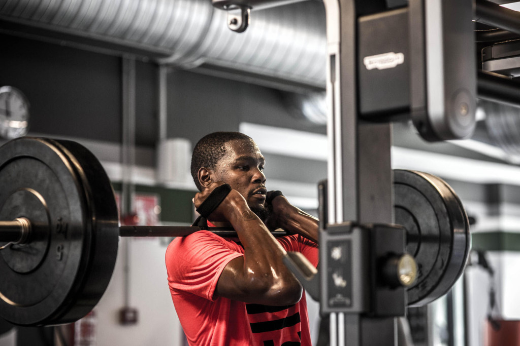 Durant lifts weights at a local gym following on-court drills and shooting.